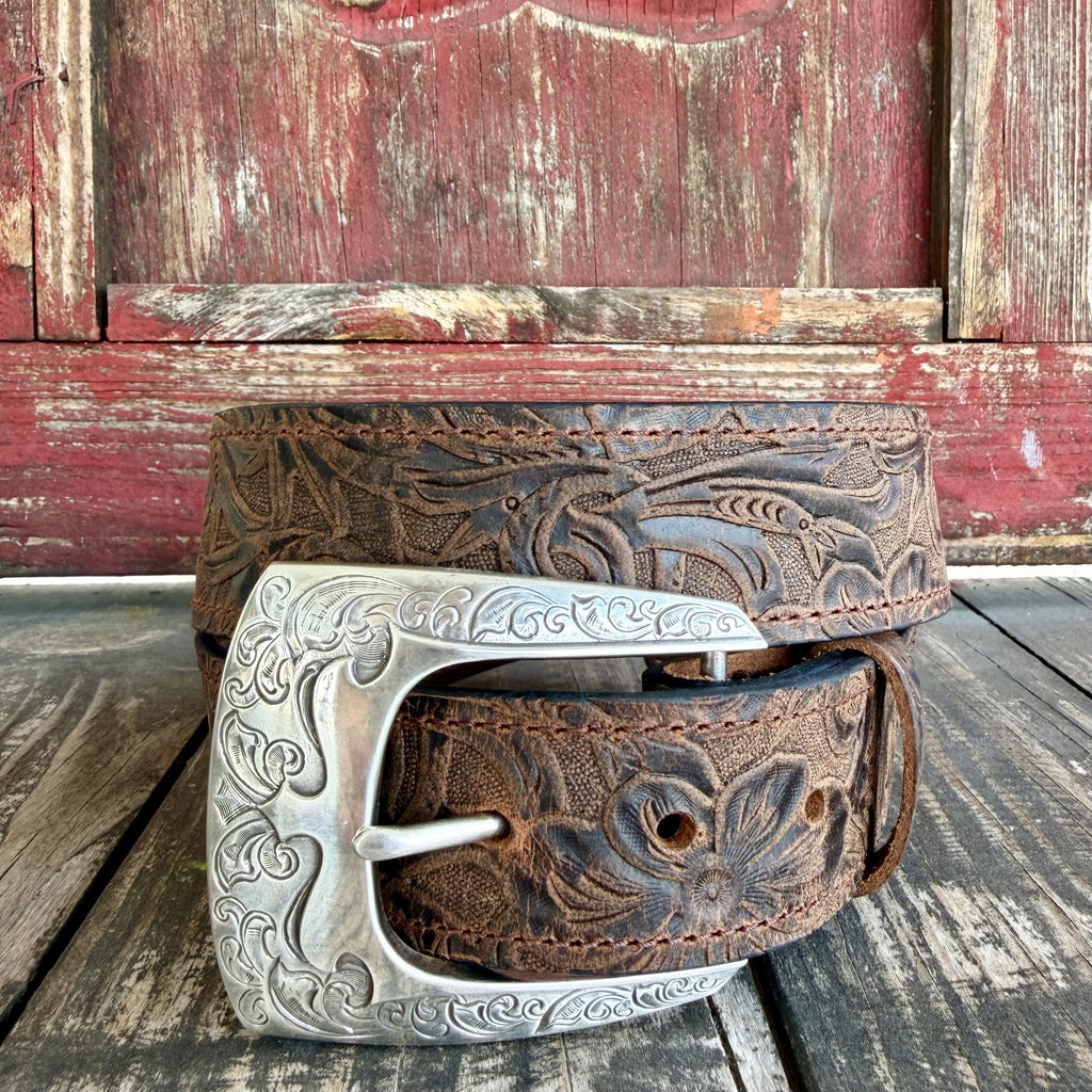 Brown leather floral tooled belt with dark scroll accents, tonal stitching and an engraved silver-tone buckle — Blair's Western Wear Marble Falls TX