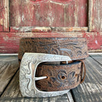 Brown leather floral tooled belt with dark scroll accents, tonal stitching and an engraved silver-tone buckle — Blair's Western Wear Marble Falls TX