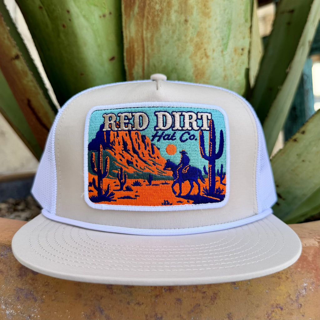 Men's white mesh trucker cap with embroidered Western scene of cowboys riding horses against a classic Western backdrop — Blair's Western Wear Marble Falls TX