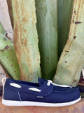  Full side — navy twill, cream rope lace bow, oval vamp keeper, HEYDUDE patch, white EVA sole