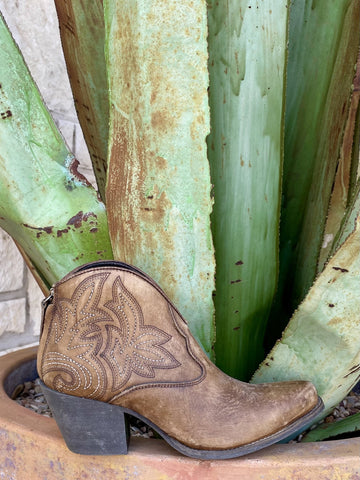 Full side profile — distressed brown, ornate stitching, snip toe, back zip