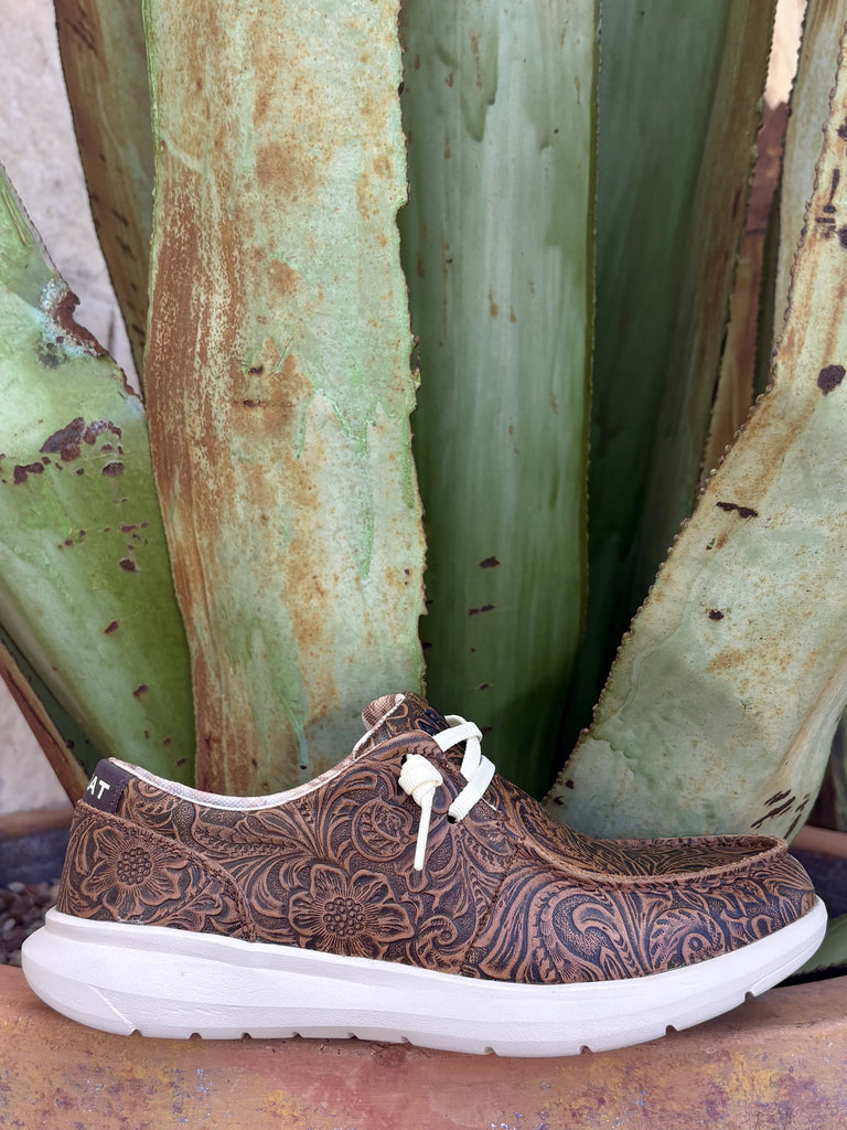 Full side — all-over floral scroll tooling, white laces, geometric collar lining, white FLX Foam sole
