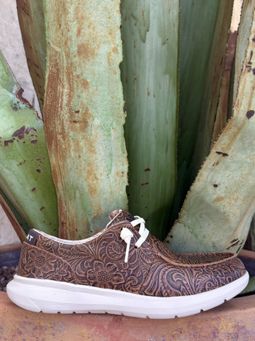 Full side — all-over floral scroll tooling, white laces, geometric collar lining, white FLX Foam sole
