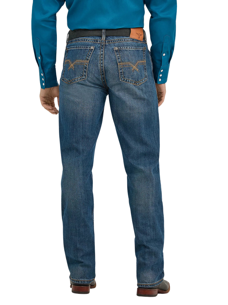 Rear view of a man wearing blue denim jeans with a brown leather belt and a bright blue long-sleeve shirt, shown against a plain white background.