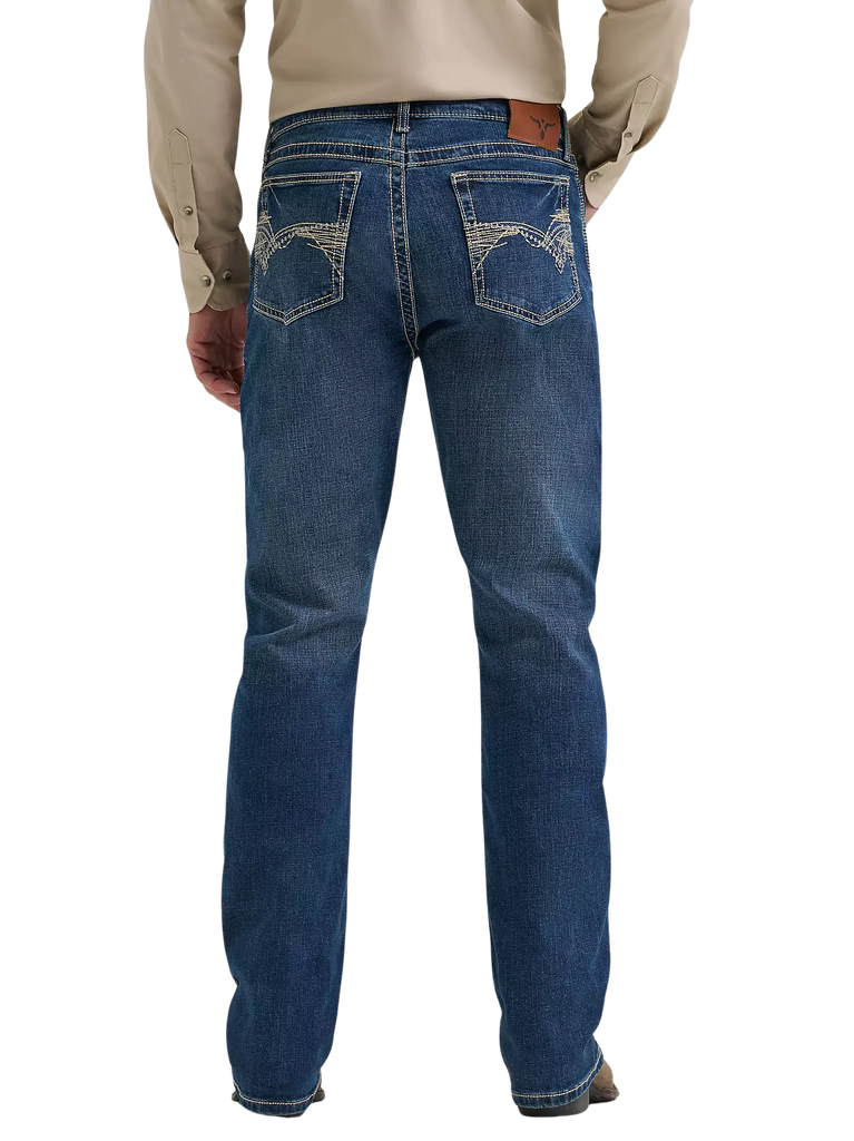 Rear view of a person wearing blue denim jeans with a beige long-sleeve shirt, shown against a plain white background.