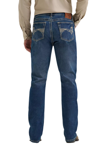 Rear view of a person wearing blue denim jeans with a beige long-sleeve shirt, shown against a plain white background.