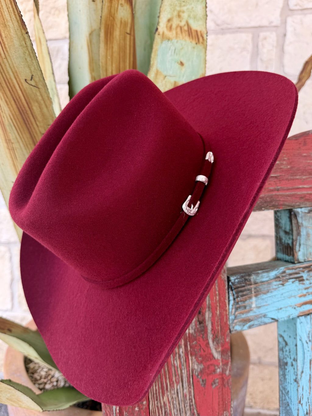 Cranberry felt hat with a cattleman crown, upturned brim and matching hatband with silver-tone buckle details — Blair's Western Wear Marble Falls TX
