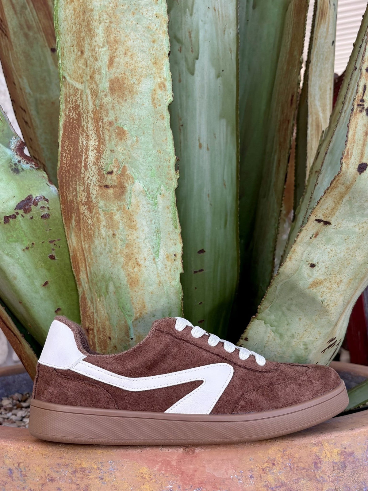  Chestnut suede side profile — white stripe panel, gum sole, agave backdrop