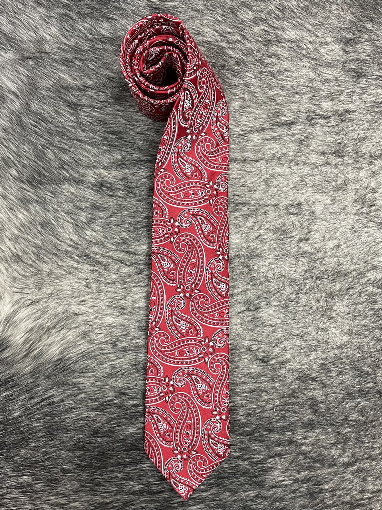 Men's red and white paisley necktie folded flat, bold red ground with intricate white and black paisley print — Blair's Western Wear Marble Falls TX