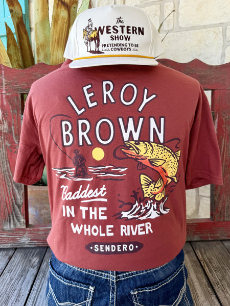 Men's brick red Sendero Provisions Co. Leroy Brown short sleeve tee with white yellow Leroy Brown Sendero chest badge, front view styled with jeans and tooled leather belt — Blair's Western Wear Marble Falls TX