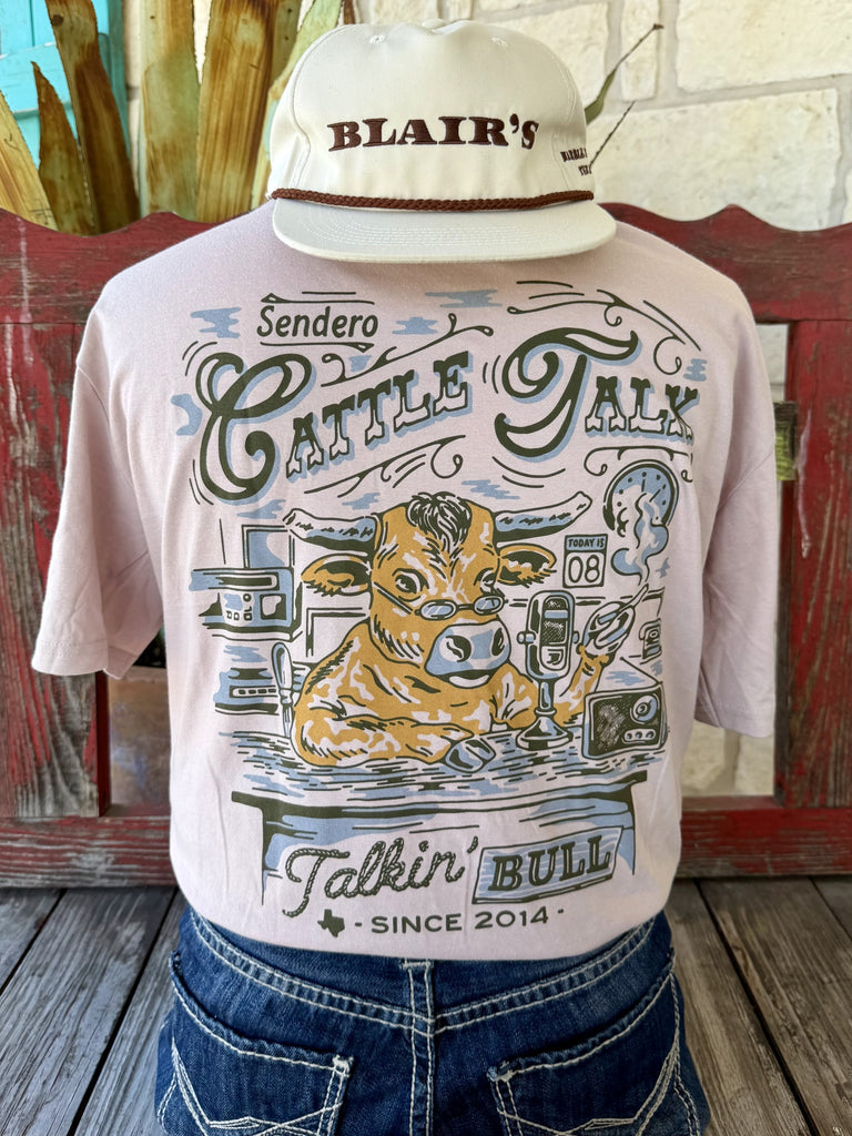 Men's lavender Sendero Provisions Co. Cattle Talk short sleeve tee with olive tan Talkin' Bull Sendero chest badge featuring longhorn bull illustration, front view styled with jeans and tooled leather belt — Blair's Western Wear Marble Falls TX