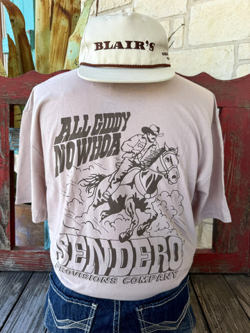 Men's tan Sendero Provisions Co. All Giddy No Whoa short sleeve tee with chocolate cowboy on horseback back graphic and Sendero Provisions Company banner, back view — Blair's Western Wear Marble Falls TX