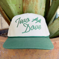 White structured snapback cap with green embroidered Two Dove script logo and two dove birds on front panel, green flat brim — Blair's Western Wear Marble Falls TX