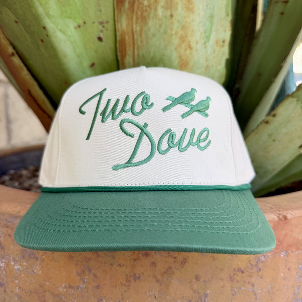White structured snapback cap with green embroidered Two Dove script logo and two dove birds on front panel, green flat brim — Blair's Western Wear Marble Falls TX