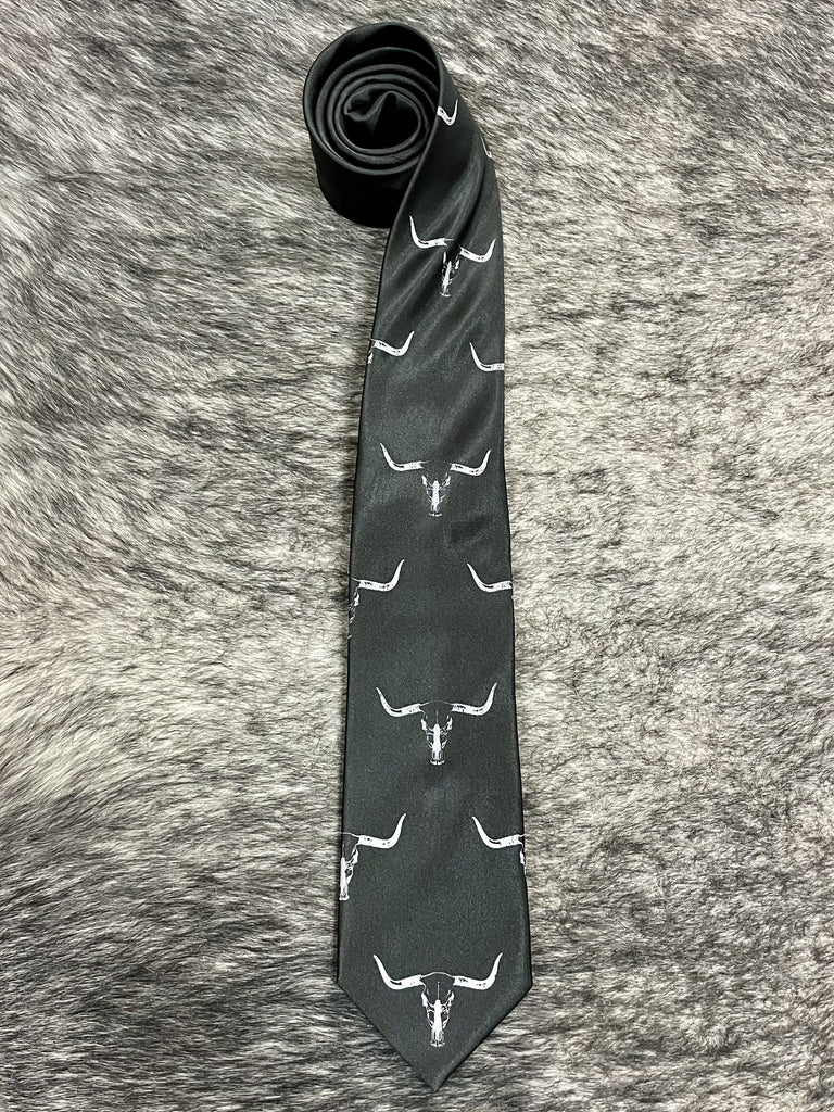 Men's black satin necktie with repeating white longhorn steer skull novelty print, smooth finish, standard width pointed tip — Blair's Western Wear Marble Falls TX
