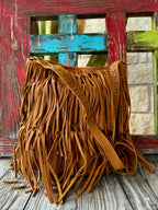 Women’s American Darling crossbody leather fringe bag in tan, built from soft full-grain leather, with an adjustable studded strap for comfortable wear – ADBGM308A. Available at Blair's Western Wear, Marble Falls, TX.