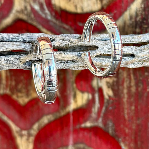 Silver hoop earrings with etched line detailing, crafted in polished silver for a versatile everyday look, with secure hinged closure for confident wear - 81160. Available at Blair's Western Wear, Marble Falls, TX.