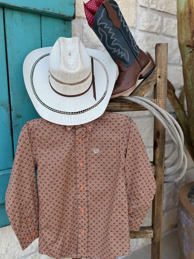 Boy's Long Sleeve Cinch Button Down Shirt - MTW7060389. This shirt features an orange, gray and white geometrical pattern and it has a pocket on the left side of the chest. Available at Blair's Western Wear located in Marble Falls, TX