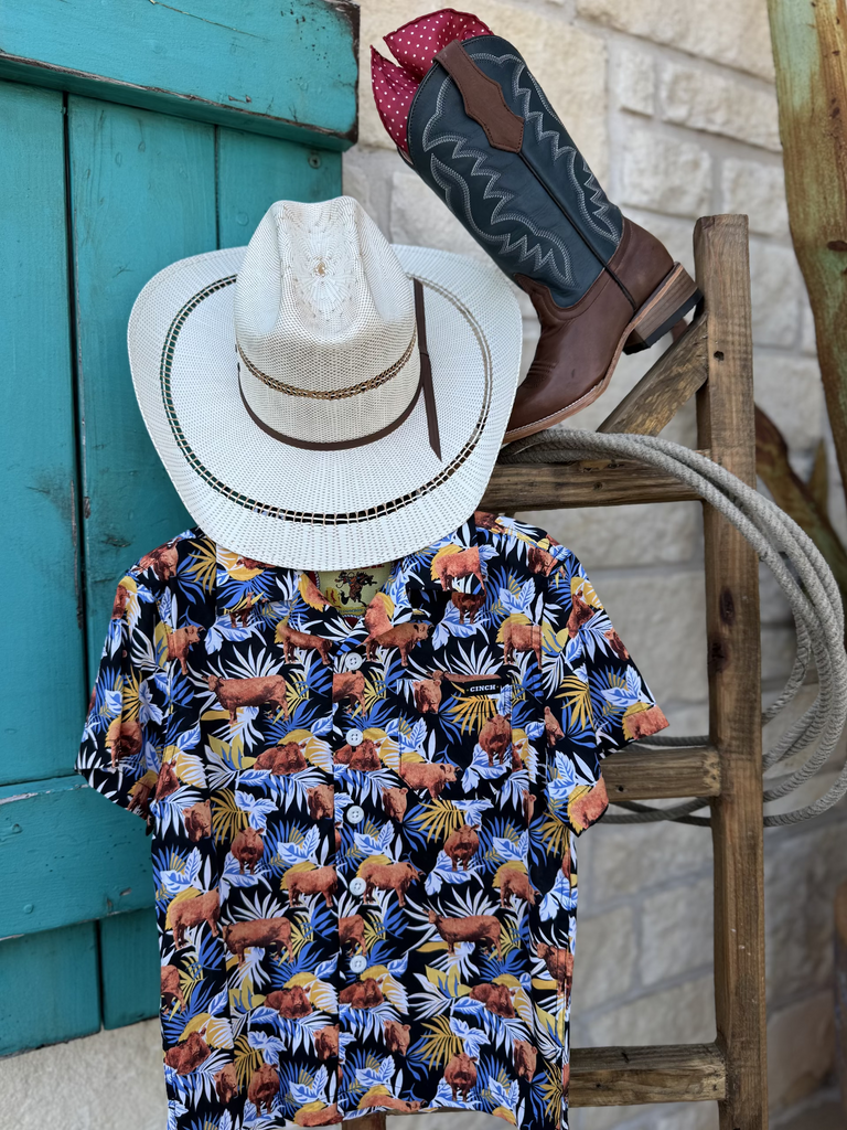 Boy's Short Sleeve Cinch Shirt (MTW7170001) . It features a tropical black, blue,white and orange design along with cattle graphics all over. Available at Blair's Western Wear located in Marble Falls, TX. 
