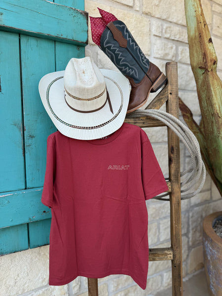 Boy's short sleeve red t-shirt with 'ARIAT' branding on the left side of the chest. Available at Blair's Western Wear located in Marble Falls, TX. 
