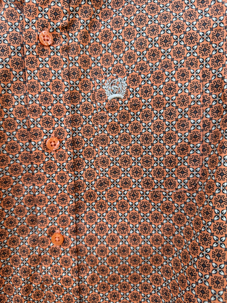 Close up of Boy's Long Sleeve Cinch Button Down Shirt - MTW7060389. This shirt features an orange, gray and white geometrical pattern and it has a pocket on the left side of the chest. Available at Blair's Western Wear located in Marble Falls, TX