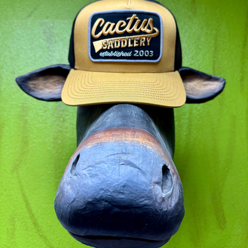 Cactus Saddlery mesh back cap hat in tan and black, breathable mesh back increases airflow to keep your head cool during long days outdoors, with adjustable snapback closure allows for a secure customizable fit that stays comfortable all day - RDHC588. Available at Blair's Western Wear, Marble Falls, TX.