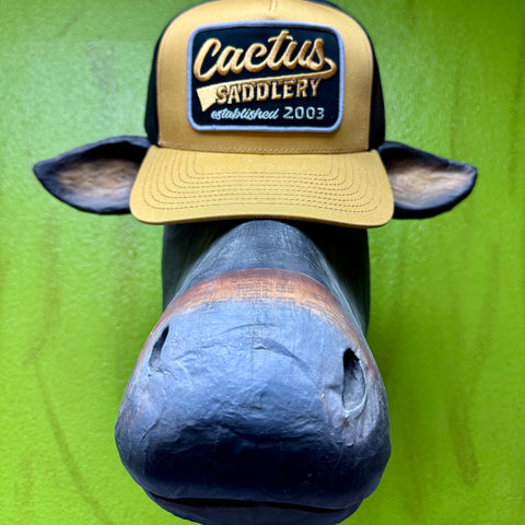 Cactus Saddlery mesh back cap hat in tan and black, breathable mesh back increases airflow to keep your head cool during long days outdoors, with adjustable snapback closure allows for a secure customizable fit that stays comfortable all day - RDHC588. Available at Blair's Western Wear, Marble Falls, TX.