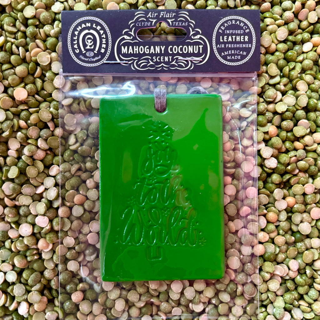 Callahan Leather air freshener rectangle in green, embossed with Joy to the World design, featuring long-lasting mahogany coconut scent, with soft suede hanging tie - AFRDJTTGRNLTH. Available at Blair's Western Wear, Marble Falls, TX.