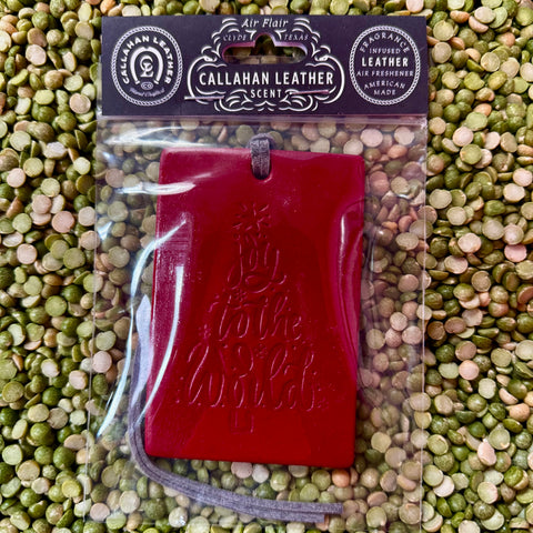 Callahan Leather air freshener rectangle in red, made from genuine leather for long-lasting fragrance, with embossed Joy to the World design – AFRDJTTREDLTHRCT. Available at Blair's Western Wear, Marble Falls, TX.