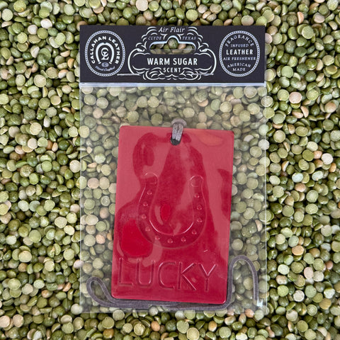 Callahan Leather Air Freshener Red Lucky in Warm Sugar Scent, crafted from American leather, with embossed horseshoe design and leather hanging strap - AFRECLUCKYRD. Available at Blair's Western Wear, Marble Falls, TX.
