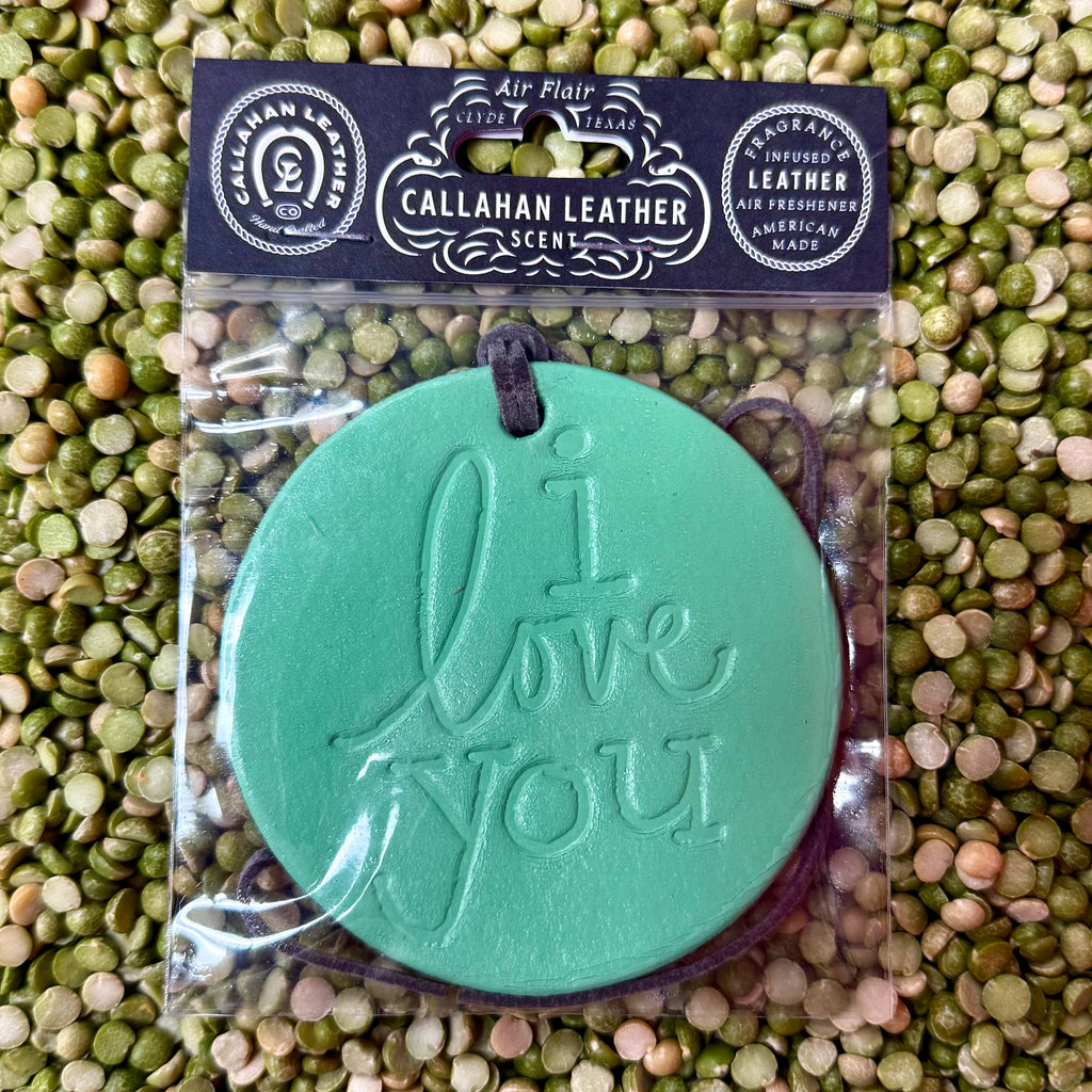 Callahan Leather air freshener round leather “I Love You” in seafoam, crafted from fragrance-infused leather, with a sturdy hanging cord – AFRDILYSFMLTHR. Available at Blair's Western Wear, Marble Falls, TX.