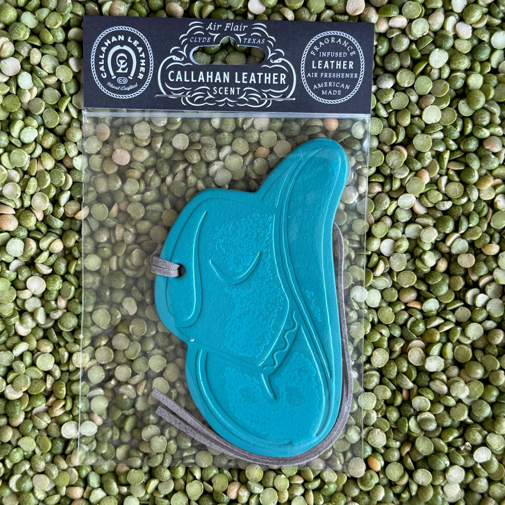 Callahan Leather Air Freshener cowboy hat shape in teal, crafted from full-grain leather with rich Leather scent and leather hanging lace – AFHATTRQLTH. Available at Blair's Western Wear, Marble Falls, TX.