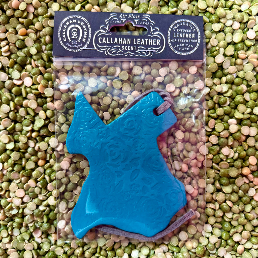 Callahan Leather air freshener Texas-shaped turquoise piece with embossed rose pattern, infused with long-lasting leather fragrance, with a soft suede hanging cord – AFTXPTTRNTRQLTHROS. Available at Blair's Western Wear, Marble Falls, TX.
