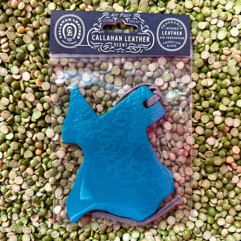 Callahan Leather air freshener Texas-shaped turquoise piece with embossed rose pattern, infused with long-lasting leather fragrance, with a soft suede hanging cord – AFTXPTTRNTRQLTHROS. Available at Blair's Western Wear, Marble Falls, TX.