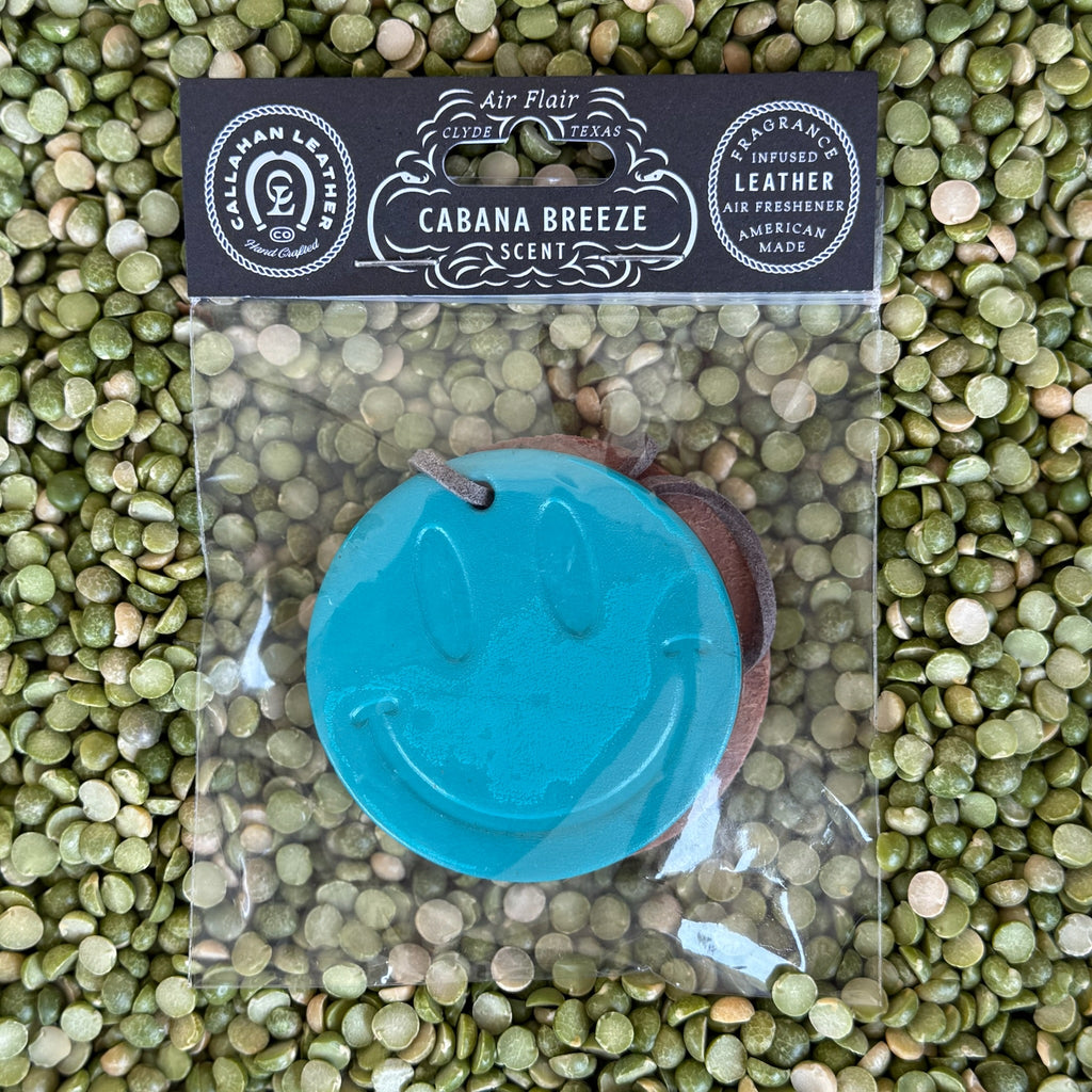 Callahan Leather Air Freshener Double Smile in Turquoise, full‑grain leather infused with long‑lasting Cabana Breeze tropical fragrance, featuring a double‑sided smiley face design – AFDBLSMILETRQ. Available at Blair's Western Wear, Marble Falls, TX.