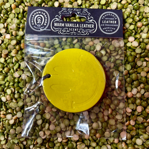 Callahan Leather air freshener double smile disc in yellow, infused with warm vanilla leather scent, with a durable leather build that maintains fragrance longer – AFDBLSMILEYLLWVL. Available at Blair's Western Wear, Marble Falls, TX.