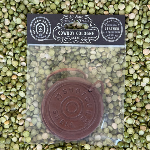 Callahan Leather air freshener shaped like a shotgun shell in brown leather, infused with Cowboy Cologne scent featuring citrus and amber accords, with leather strap - AFDBLSGCRWCC. Available at Blair's Western Wear, Marble Falls, TX.