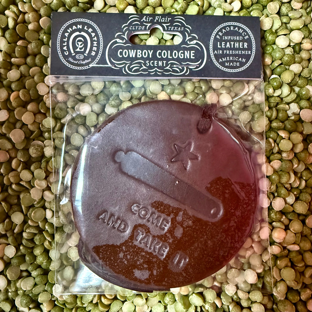Callahan Leather Co. air freshener round leather Come and Take It in brown, infused with long-lasting Cowboy Cologne scent, with an embossed Texas-inspired design – AFRCATIBRWCC. Available at Blair's Western Wear, Marble Falls, TX.