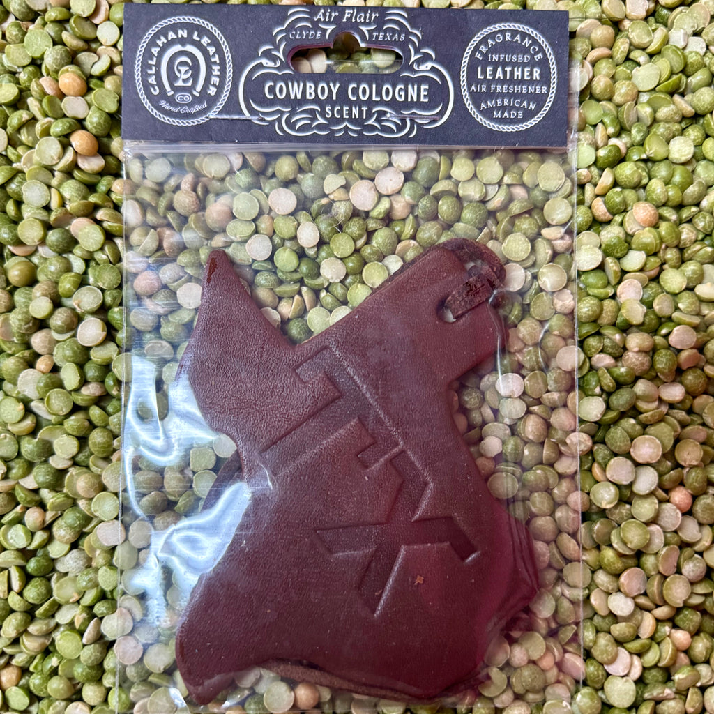 Callahan Leather Co. air freshener Texas-shaped leather item in brown, built from fragrance-infused leather that holds scent longer, with an embossed TX design that adds a Western touch – AFTXSTXBRWCC. Available at Blair's Western Wear, Marble Falls, TX.