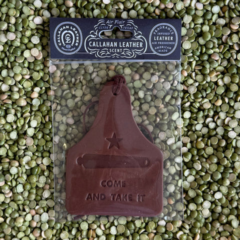 Callahan Leather Cow Tag Air Freshener in Brown, handcrafted from full-grain leather, embossed with “Come and Take It” design, and infused with premium fragrance oils – AFCWCATIBRW. Available at Blair's Western Wear, Marble Falls, TX.