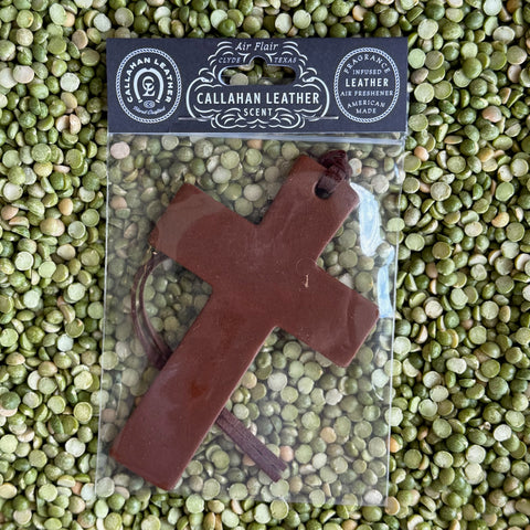 Callahan Leather Cross Leather Air Freshener in Brown, crafted from fragrance-infused leather for long-lasting scent, with a sturdy hanging loop for convenient use - AFCROSSBRWLTH. Available at Blair's Western Wear, Marble Falls, TX.