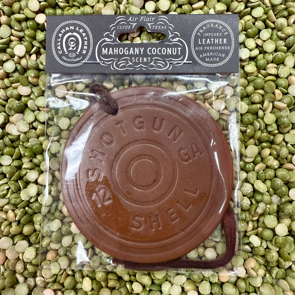 Callahan Leather Round Shotgun Mahogany Coconut Air Freshener in brown, crafted from genuine leather with a long-lasting mahogany coconut scent, with a sturdy leather strap for easy hanging - AFRSGBRWMC. Available at Blair's Western Wear, Marble Falls, TX.