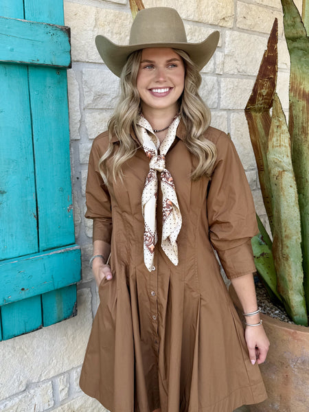 Close detail of camel puff sleeve mini dress showing cinched cuff and gathered waist — Blair's Western Wear Marble Falls TX