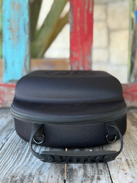 The Cactus Ally Hat Company Cap Carrier keeps your favorite caps protected and organized on the go. Designed in sleek black, it holds 4–5 caps securely and includes a built-in sunglasses case for added convenience. Carry it your way with both handheld and shoulder strap options—perfect for travel, rodeos, or everyday use. Available at BLAIR'S Western Wear located in Marble Falls, TX 