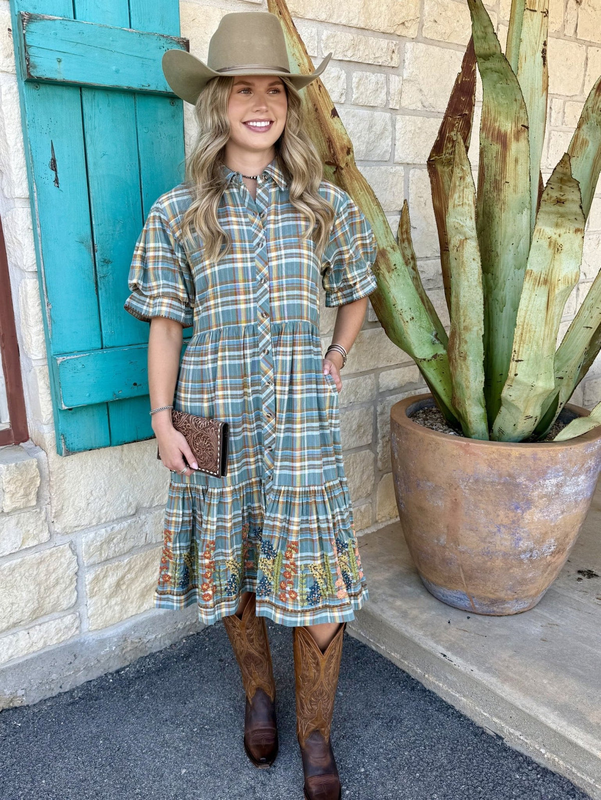 Women's blue, brown, and green plaid midi dress with puff sleeves, tiered skirt, and embroidered floral hem border — Blair's Western Wear Marble Falls TX