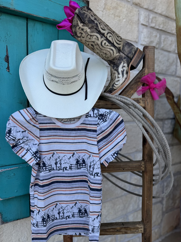 Girl's Short Sleeve Western Tee - CTK8005003 - This striped and colorful shirt features the cutest puffy sleeves and it has cute little western graphics of cowboys in the Rocky Mountains. Available at Blair's Western Wear located in Marble Falls TX