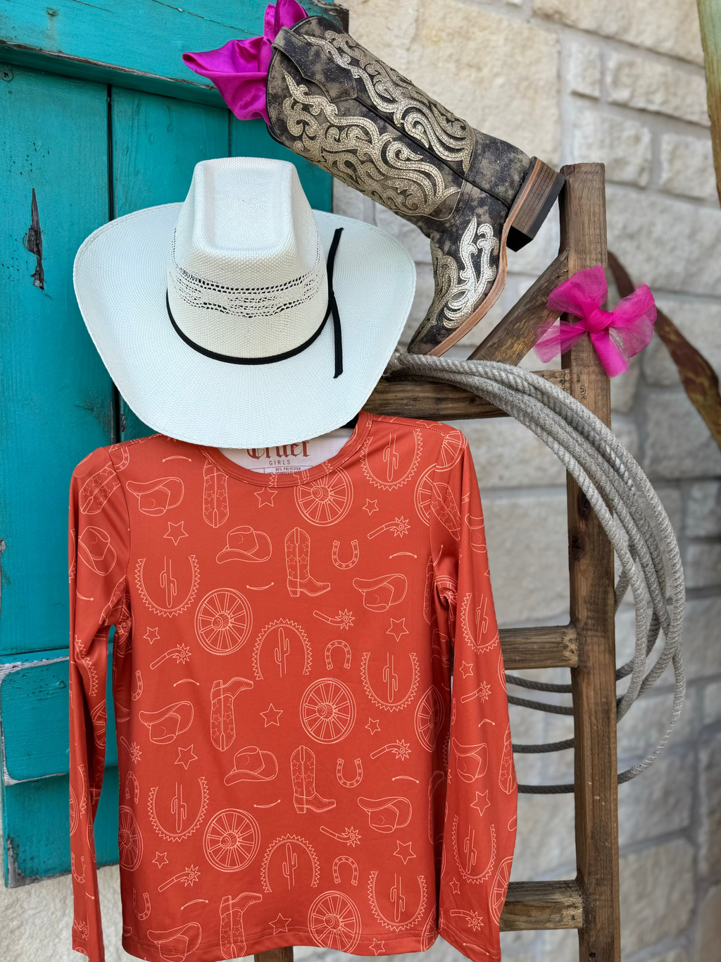 Girl's Long Sleeve Western Tee - CTK8990003 - this comfy orange shirt features such cute western graphics such as boots, horseshoes, cowgirl hats and many more! Available at Blair's Western Wear located in Marble Falls,TX. 