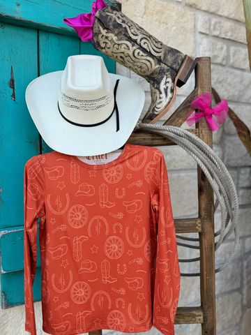 Girl's Long Sleeve Western Tee - CTK8990003 - this comfy orange shirt features such cute western graphics such as boots, horseshoes, cowgirl hats and many more! Available at Blair's Western Wear located in Marble Falls,TX. 