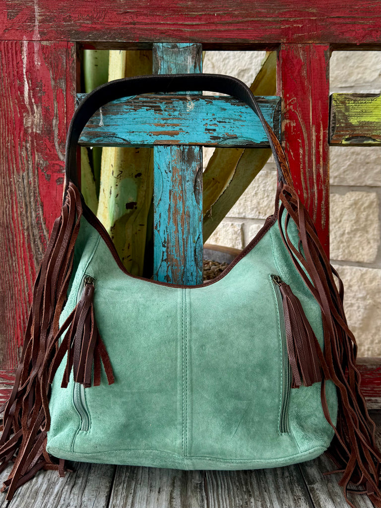Hobo leather American Darling fringe purse in mint, crafted from genuine suede for a soft yet structured feel, with hand-tooled leather accents for durability and style – ADBGA371. Available at Blair's Western Wear, Marble Falls, TX.