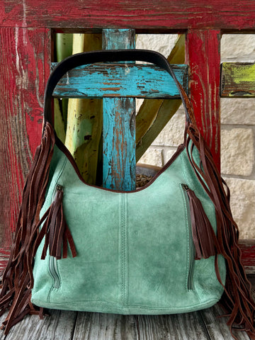 Hobo leather American Darling fringe purse in mint, crafted from genuine suede for a soft yet structured feel, with hand-tooled leather accents for durability and style – ADBGA371. Available at Blair's Western Wear, Marble Falls, TX.